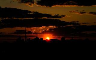 Autumn red sunset with a purple sky photo