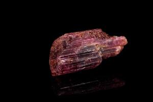 macro mineral tourmaline stone on black background photo