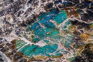 macro mineral stone labradorite on a white background photo