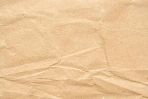 Abstract crumpled and creased recycle brown paper texture background photo