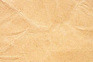 Abstract crumpled and creased recycle brown paper texture background photo