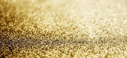 Abstract gold glitter sparkle with bokeh background photo