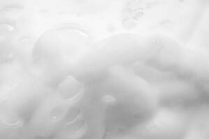 Abstract white soap foam bubbles texture background photo