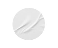 Blank white round paper sticker label isolated on white background photo