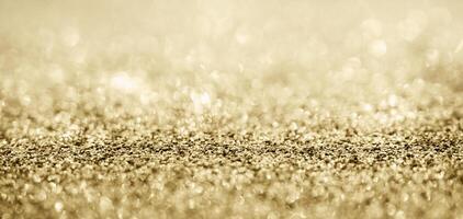 Abstract gold glitter sparkle with bokeh background photo