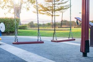 Empty chain swing in the playground photo