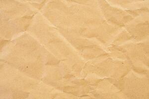 Abstract brown crumpled creased recycle paper texture background photo