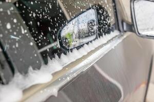 car cleaning and washing with foam soap photo