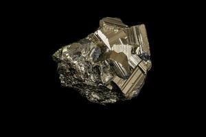 Macro mineral stone Pyrite on a black background photo