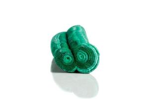 Macro mineral stone malachite stalactite on white background photo