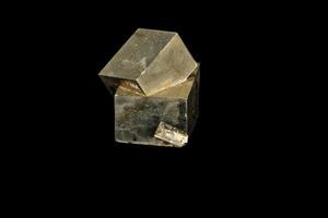 Macro mineral stone Pyrite on a black background photo