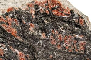 Macro of a stone Stibnite mineral on a white background photo