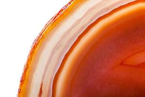 Macro mineral orange agate in crystals on white background photo