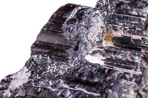 macro mineral stone sherle, schorl, black tourmaline on white background photo