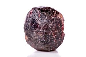 Macro of a mineral garnet stone on a white background photo