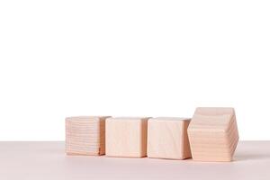 Four wooden cubes on a white background photo
