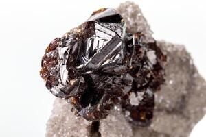 Macro of mineral Sphalerite stone on microcline on white background photo