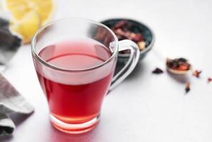 Glass cup of hot hibiscus tea. photo