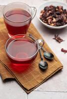 Glass cup of hot hibiscus tea. photo