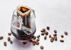 A  glass of freshly brewed drip coffee photo