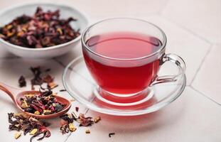 Glass cup of hot hibiscus tea. photo