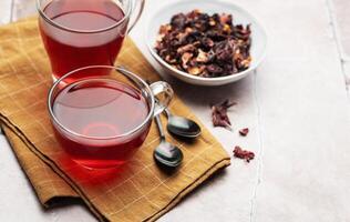 Glass cup of hot hibiscus tea. photo