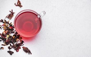 Glass cup of hot hibiscus tea. photo