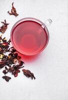 Glass cup of hot hibiscus tea. photo