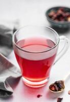 Glass cup of hot hibiscus tea. photo