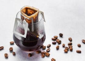 A  glass of freshly brewed drip coffee photo