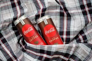 KYIV, UKRAINE - OCTOBER 31, 2023 Can of Coca Cola with coffee flavor. Closed tin can of drink with special design photo