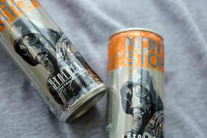 KYIV, UKRAINE - OCTOBER 31, 2023 Non Stop energy drink with limited edition design of Stalker and character with gas mask on aluminium tin can photo