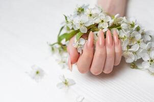 Elegant pastel pink natural manicure. photo