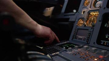 Panel of switches on an aircraft flight deck. Autopilot control element of an airliner. Pilot controls the aircraft. Onboard computer, cockpit video