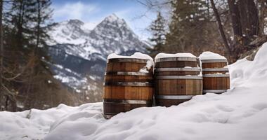 ai generado de madera barriles con metal aros, anidado en un Nevado montaña paisaje, haciendo eco de invierno pureza foto