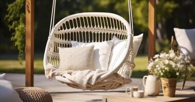 AI generated A Relaxing String Swing Adorned with a Pillow, Enhanced by Wicker Baskets and a Blanket on a Garden Deck photo