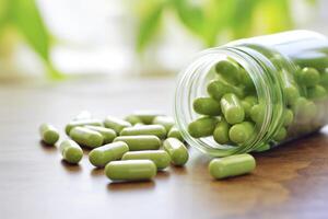 AI generated green capsules on a table photo