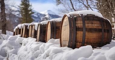 AI generated Traditional Wooden Barrels Bound by Metal Hoops Set Against a Snowy Mountain Backdrop photo