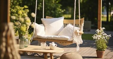 AI generated A Peaceful Swing with a Pillow on a Patio, Paired with Wicker Baskets and a Blanket photo