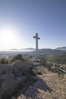 The Cross of the Castle of Santa Catalina. It is an interesting viewpoint with a cross from which can see the entire city of Jaen and its surroundings. photo