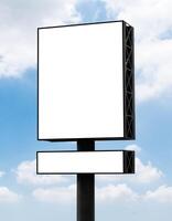 Outdoor pole vertical light box billboard on blue sky background with mock up white screen. Clipping path for mockup photo