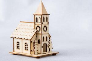 Toy church. Wooden chapel. Building model. photo