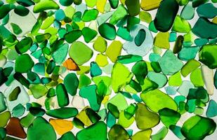 Summer background from sea glass top view. Broken glass from the ocean. Sea pattern. Oceanic mosaic. Natural colors of blue, green, white found on the coast photo