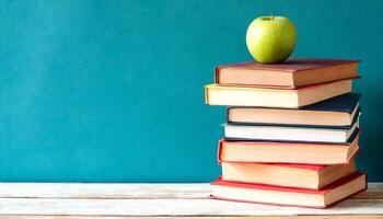 AI generated a stack of books with an apple on top photo