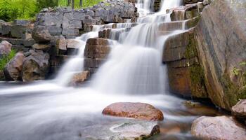 ai generado un cascada fluido terminado rocas en un bosque foto