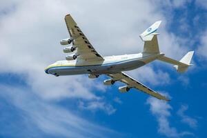 Gostomel, Ukraine - June 4, 2021. The plane Antonov 225 AN-225 Mriya, the biggest airplane in the world taking off from the airport. UR-82060 largest aircraft flying in the sky. Kyiv Kiev photo