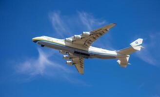 Gostomel, Ukraine - June 4, 2021. The plane Antonov 225 AN-225 Mriya, the biggest airplane in the world taking off from the airport. UR-82060 largest aircraft flying in the sky. Kyiv Kiev photo