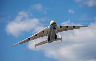 Gostomel, Ukraine - June 4, 2021. The plane Antonov 225 AN-225 Mriya, the biggest airplane in the world taking off from the airport. UR-82060 largest aircraft flying in the sky. Kyiv Kiev photo