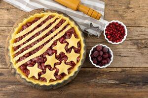 Step 3. Before baking. Homemade cherry pie. Homemade product made from dough with stars. Food for 4th July USA Independence Day. American Pie. Sweet pastries. Berry open round tart photo