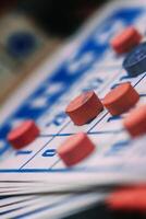 Close-up View of a Bingo Card and Red Markers During a Game Session photo